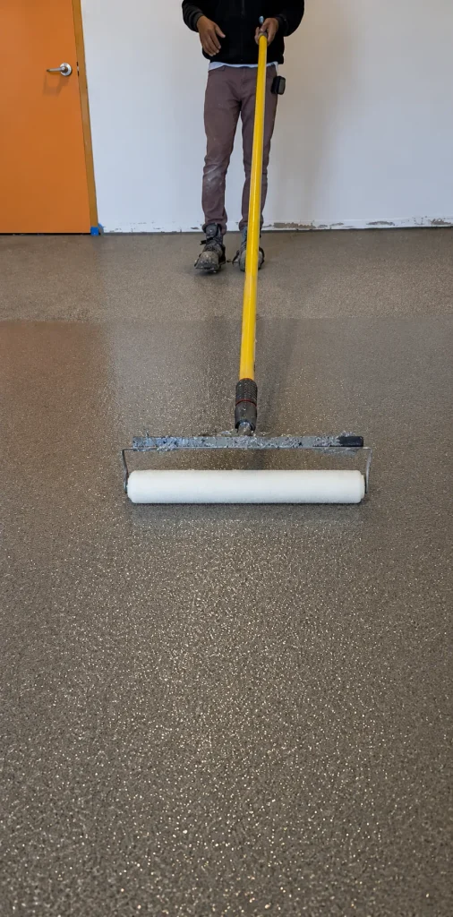 Roller smoothing the last clear layer