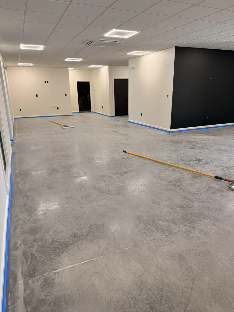 Open office space before epoxy, ground concrete ready for coating