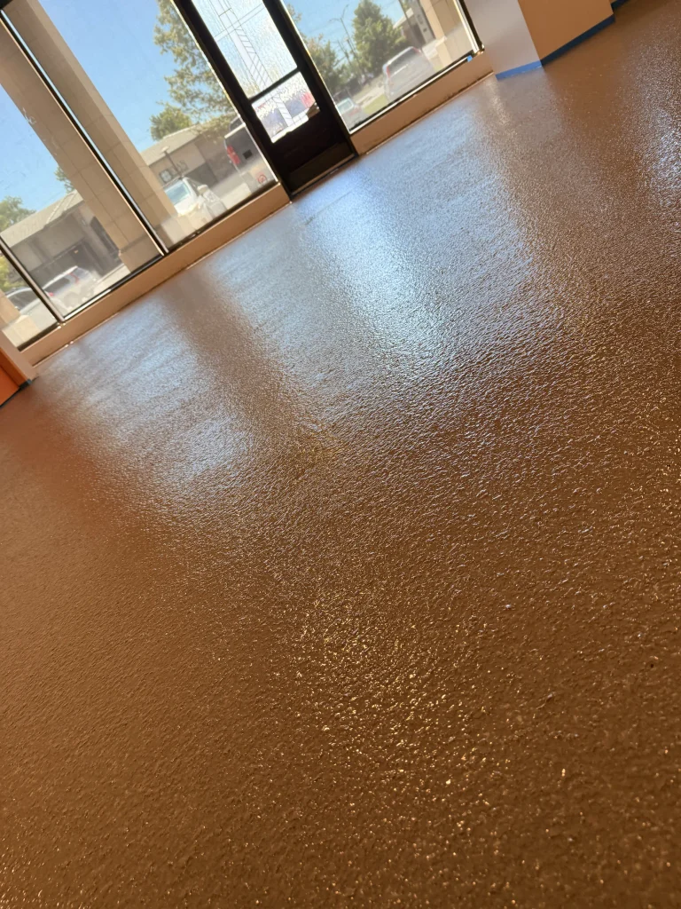 Finished tan flake epoxy floor in an Overland Park storefront