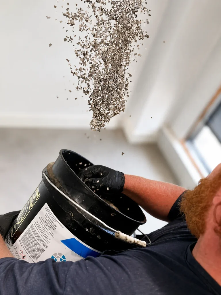 Flake being thrown to fully cover the base color